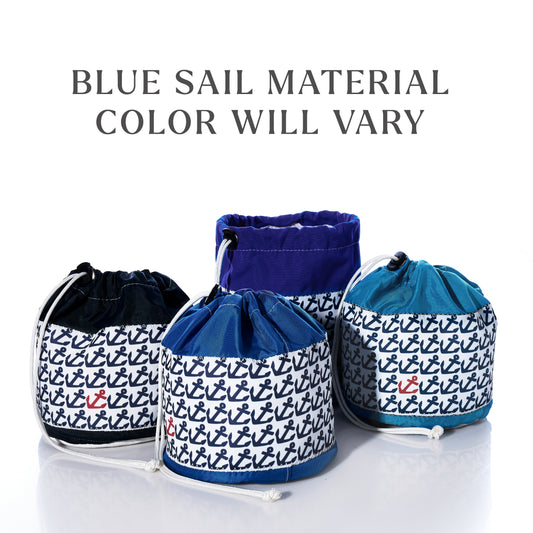 Four Sea Bags Anchor Pop Ditty Bags made from blue sail cloth with anchor patterns are shown; each bag displays a unique shade of blue. Text above reads: “BLUE SAIL MATERIAL COLOR WILL VARY.”.