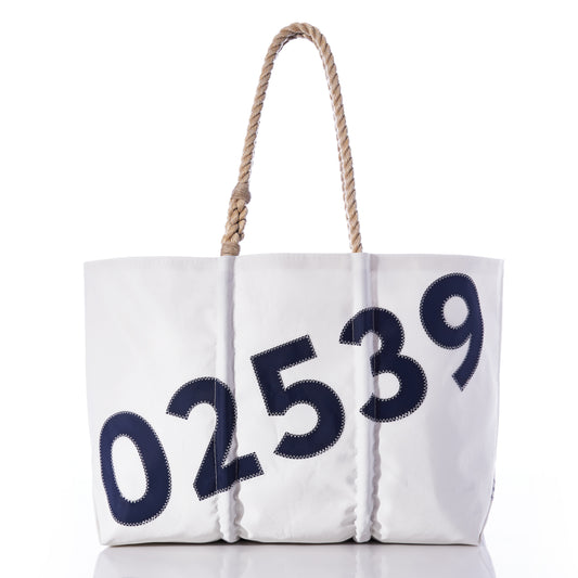 Sea Bags Custom Zip Code Tote features a white design crafted from recycled sail cloth, accented with a sturdy rope handle and bold navy numbers 02539 stitched diagonally across the front. This stylish and sustainable tote is the perfect way to carry your essentials while adding a personalized touch. by Sea Bags