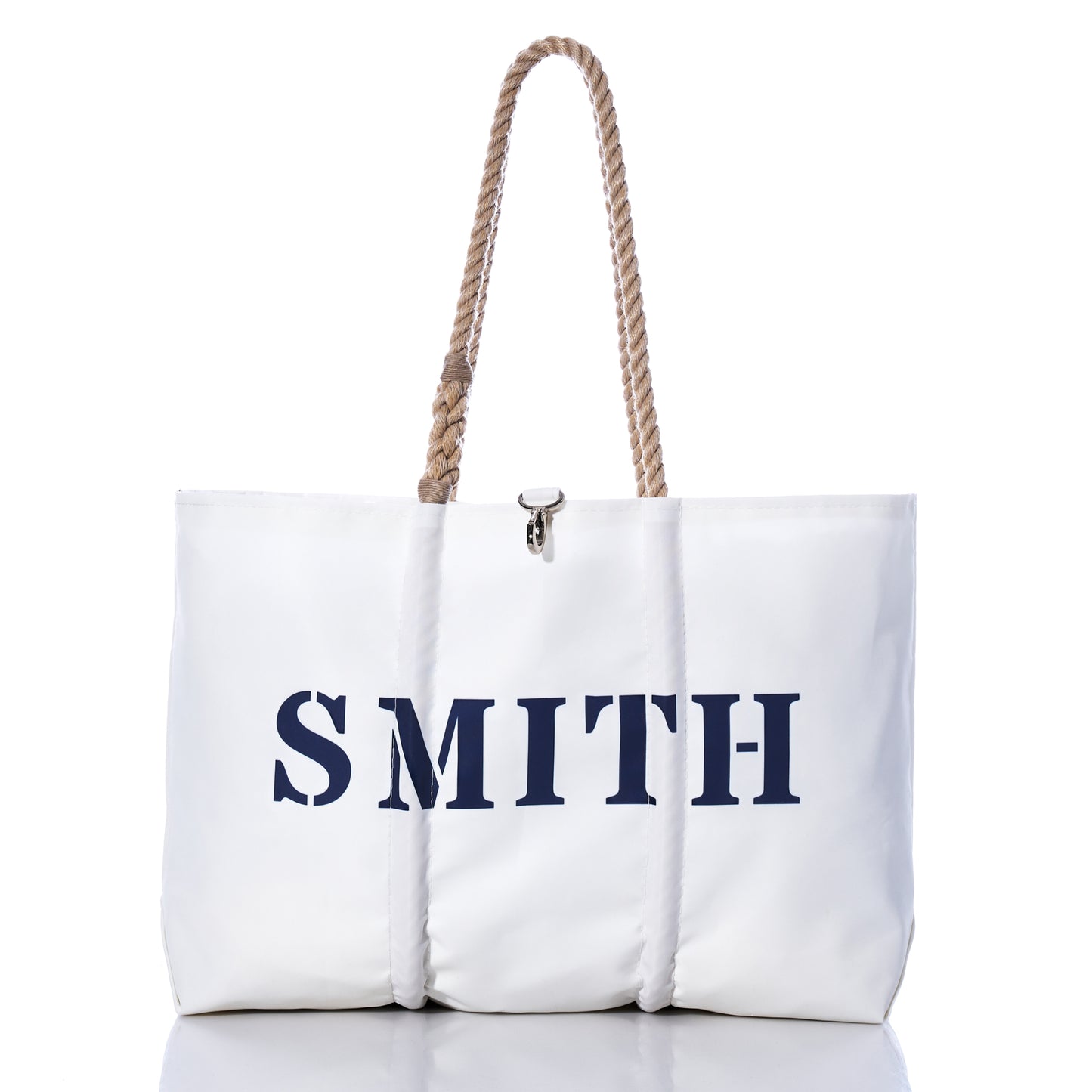 Custom Family Gift Tote - White by Sea Bags, crafted from sustainable recycled sail cloth and displayed against a white background, features thick rope handles and bold black SMITH lettering. by Sea Bags