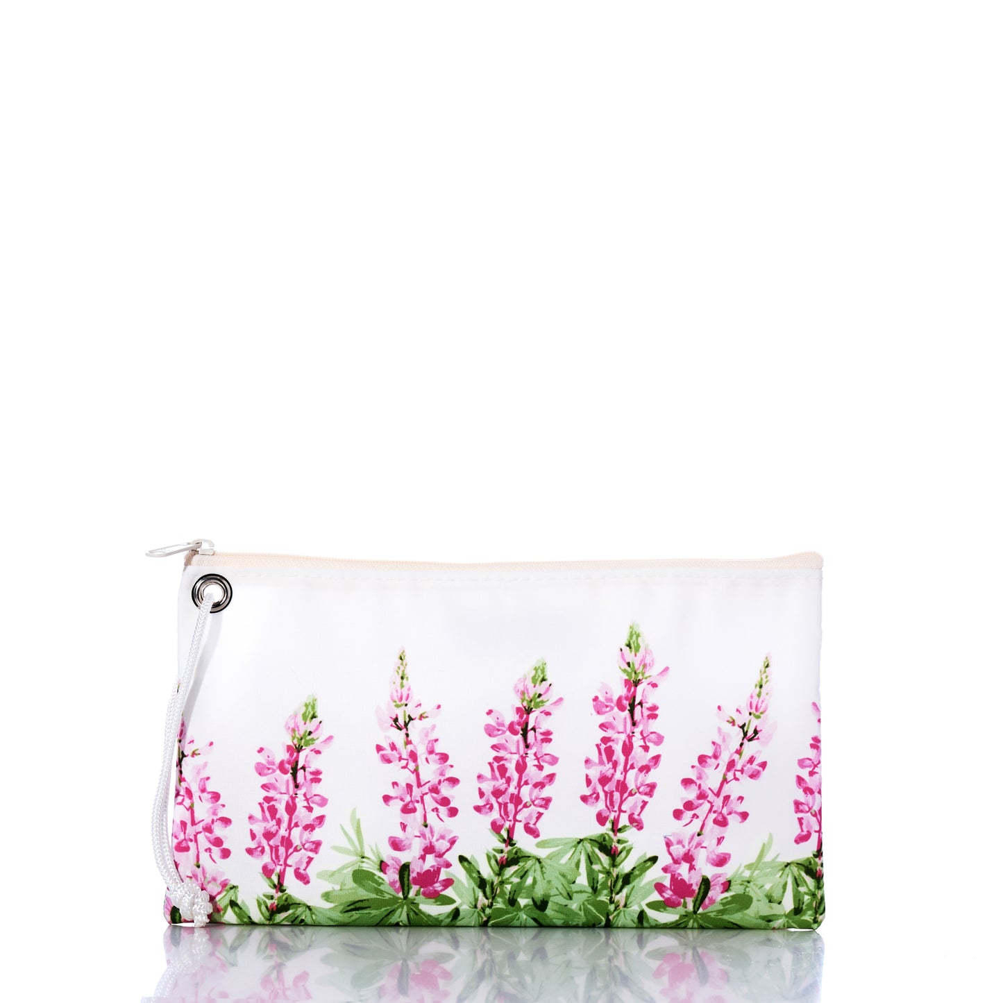 The Sea Bags Pink Lupine Large Wristlet, featuring a white zipper and wrist strap, is adorned with pink and green floral designs reminiscent of wildflowers. The wristlet is photographed on a reflective surface against a white background. by Sea Bags