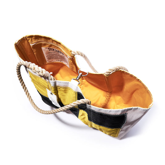 Sea Bags Lima Signal Flag Large Tote, made from recycled sail cloth inspired by vintage Maritime Signal Flags, features an open yellow design with black and white stripes, beige rope handles, and an orange interior—shown from above on a white background. by Sea Bags