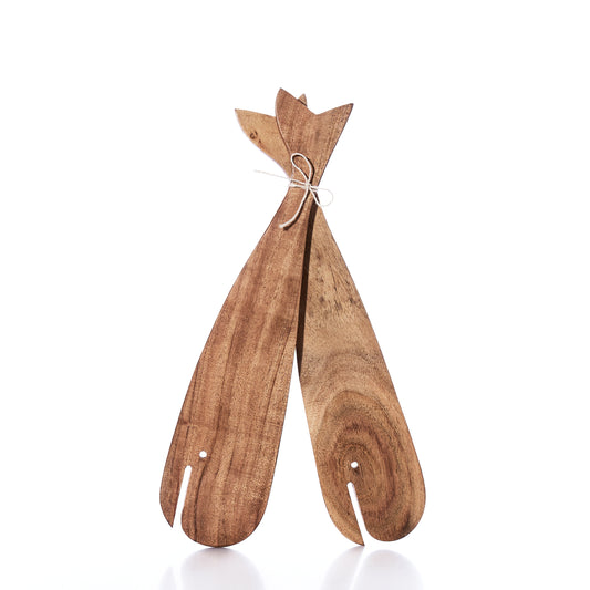 The Salad Server Set - Wood Whales from Batela USA Inc features a pair of wooden whale-shaped salad servers with fish-inspired handles, tied together with a white string and displayed on a crisp white background, adding coastal charm to your table. by Sea Bags
