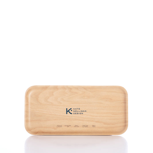 A rectangular wooden box, the Kate Nelligan Full Sail Tray by Trays4Us, crafted from Scandinavian birch with rounded edges and Kate Nelligan Design printed on the lid, is shown against a white background. by Sea Bags