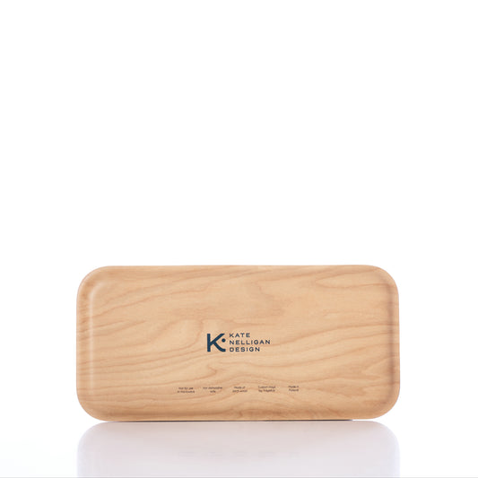 A rectangular wooden tray with rounded corners, crafted from Scandinavian birch and showcasing the Kate Nelligan Lures design and logo on the surface, set against a white background. Made in Finland by Trays4Us. by Sea Bags