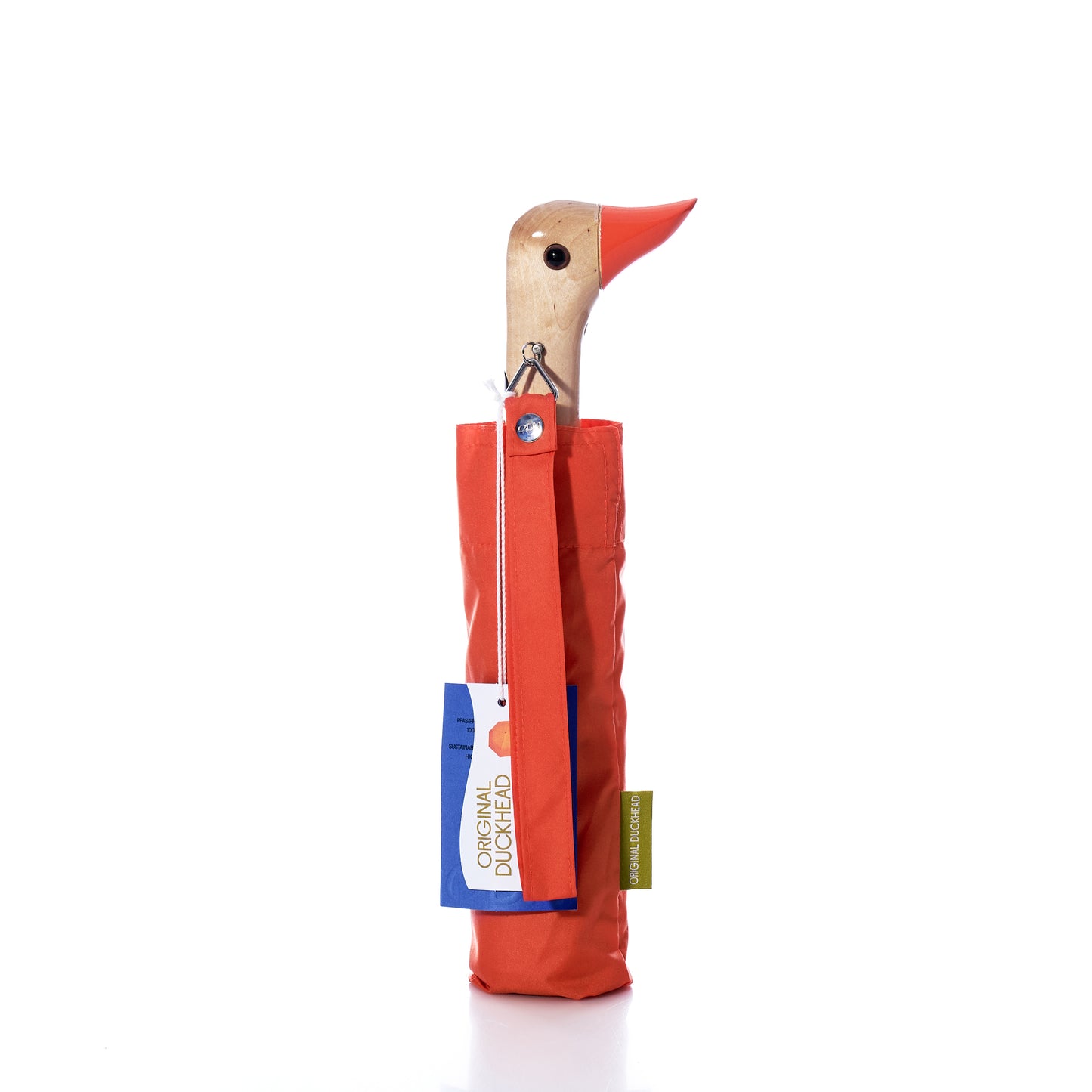 The Original Duck Head Umbrella - Papaya by ODH Limited t/a Original Duckhead features a charming handle shaped like a duck’s head with a wooden texture and orange beak. This wind resistant umbrella combines unique style with durability and comes complete with attached tags.