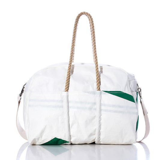 The Sea Bags Vintage Green 64 Weekender, featuring a white and green design with two durable hemp handles, a side shoulder strap, and three exterior pockets, is photographed on a reflective surface against a white background. by Sea Bags