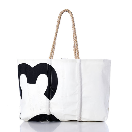 The Sea Bags Vintage 353 Large Tote features a black abstract design on white, accented with hand-spliced rope handles inspired by classic sail tote styles, and is elegantly presented on a reflective surface against a white background. by Sea Bags