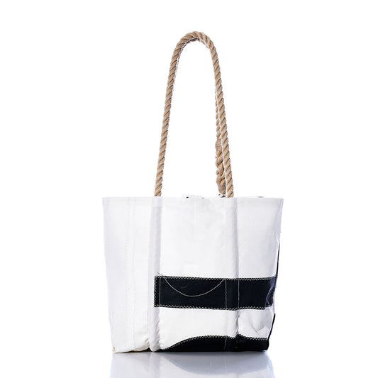 Presenting the Sea Bags Vintage 162 Handbag—a white tote featuring a black stripe accent at the bottom and durable hemp rope handles, photographed against a clean white background. Inspired by sail insignia design, this versatile piece is ideal for those who appreciate classic nautical style. by Sea Bags