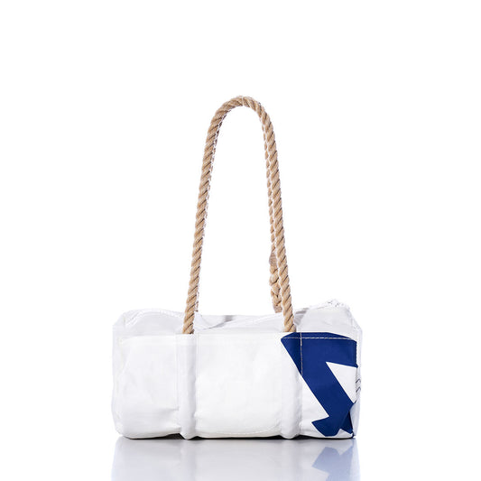 The Sea Bags Vintage 420 Baguette Bag is a white rectangular handbag featuring a blue geometric accent and two thick hemp rope handles, evoking classic vintage baguette styles. Its displayed against a white background. by Sea Bags