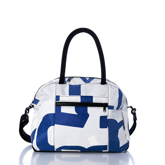 Introducing the Vintage Blue Numbers Essential Weekender Travel Bag by Sea Bags—this white carryon features an abstract blue numbers print, sturdy black handles, a detachable shoulder strap, zippered front pocket, and a convenient trolley sleeve. Perfect for travel, it’s pictured here on a reflective white surface. by Sea Bags