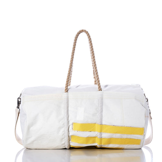The Vintage C Scow Duffel by Sea Bags is a white duffel bag featuring yellow stripes, rope handles, and a detachable shoulder strap. Crafted from recycled sail cloth, it is photographed against a white background with a reflective surface. by Sea Bags