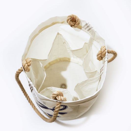 Top view of the Sea Bags Navy Anchor Beverage Bucket Bag, crafted from recycled sail cloth with rope handles and multiple interior pockets, shown open on a white background. by Sea Bags
