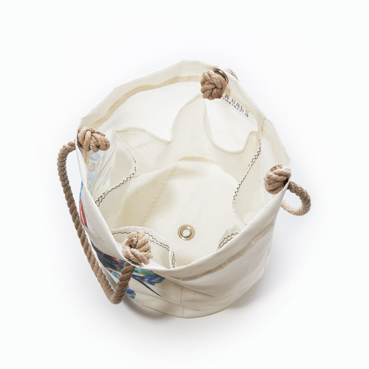 Sea Bags Watercolor Crab Beverage Bucket, a white canvas bucket bag featuring rope handles and metal grommets, is viewed from above to reveal its empty interior—a perfect coastal organizer inspired by a Maine artist and reminiscent of a classic blue crab bucket. by Sea Bags