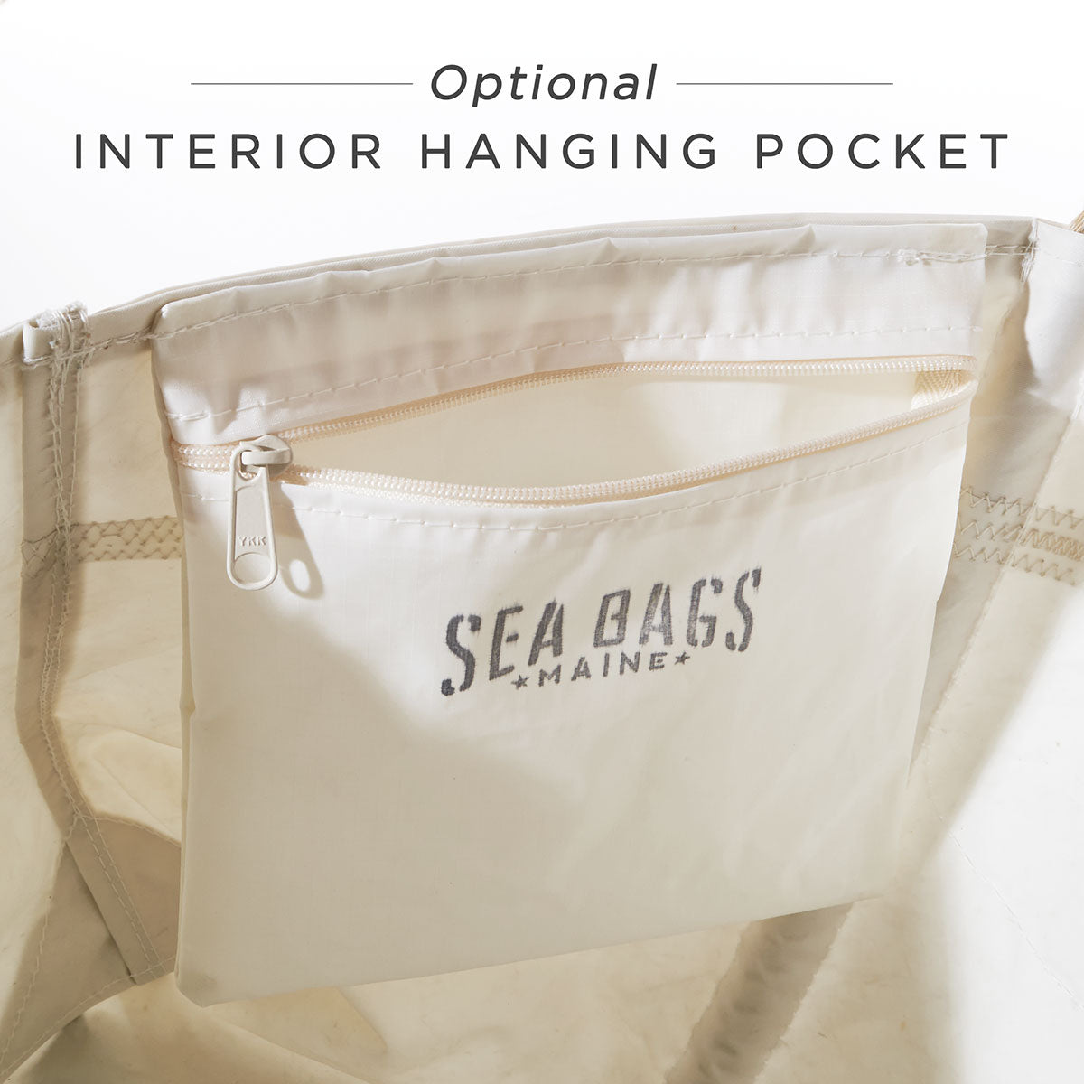 Navy Anchor Large Tote with an interior featuring an optional zippered hanging pocket labeled Sea Bags in gray text, crafted from durable recycled-sail material and finished with sturdy hemp rope handles. by Sea Bags