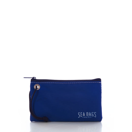 A small blue Sunflower Wristlet with a zippered closure, wrist strap, and Sea Bags printed in white on the lower right corner is shown on a white background—an ideal organizer from Sea Bags for nature lovers who appreciate both style and function. by Sea Bags