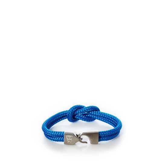 A Lemon Line Square Knot Bracelet in blue, featuring a braided rope design and silver metal hook clasp, displayed on a white background—an ideal summer accessory. by Sea Bags