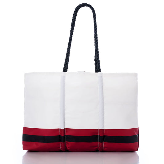 Atlanta Falcons Tailgate Tote by Sea Bags, crafted from recycled sail cloth, features bold red and black horizontal stripes along the bottom and sturdy black rope handles. Photographed on a white background, this eco-friendly tote showcases Atlanta Falcons spirit with a stylish and sustainable design. by Sea Bags