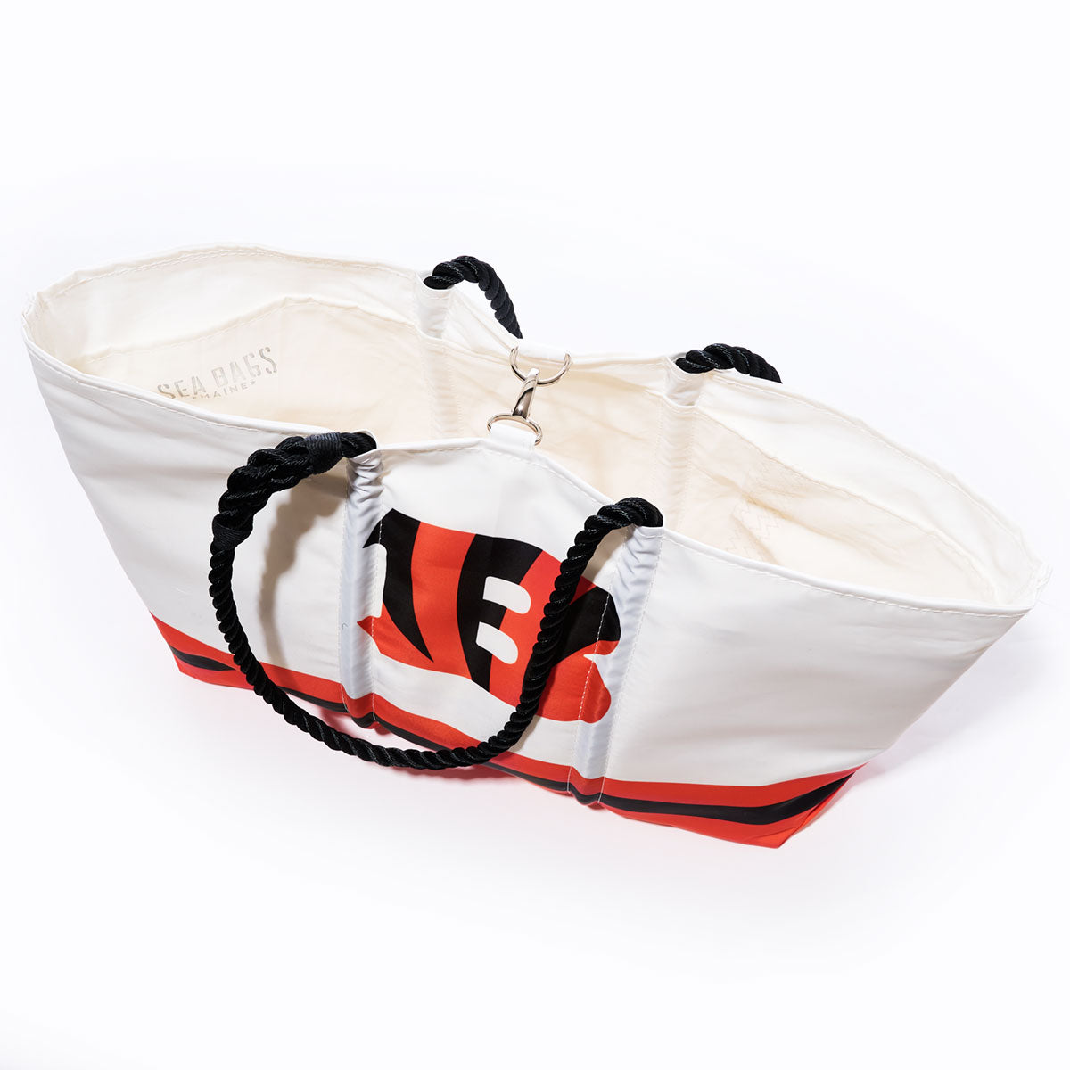 Sea Bags’ Cincinnati Bengals Tailgate Tote features durable recycled sail cloth, sturdy black rope handles, an open top, and a striking red and black Bengals graphic on the front for standout style. by Sea Bags