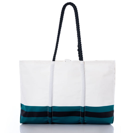The Sea Bags Jacksonville Jaguars Tailgate Tote is a white tote bag featuring black rope handles and teal and black horizontal stripes near the base, crafted from recycled sail cloth—perfect for fans who want a subtle nod to their team. It is shown against a plain white background. by Sea Bags