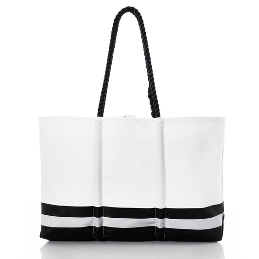 The Sea Bags Las Vegas Raiders Tailgate Tote, crafted from recycled sail cloth, features black rope handles and two horizontal black stripes at the bottom, taking inspiration from classic NFL logo tote designs. Displayed on a white background, it’s an ideal addition to any Las Vegas Raiders bag collection. by Sea Bags