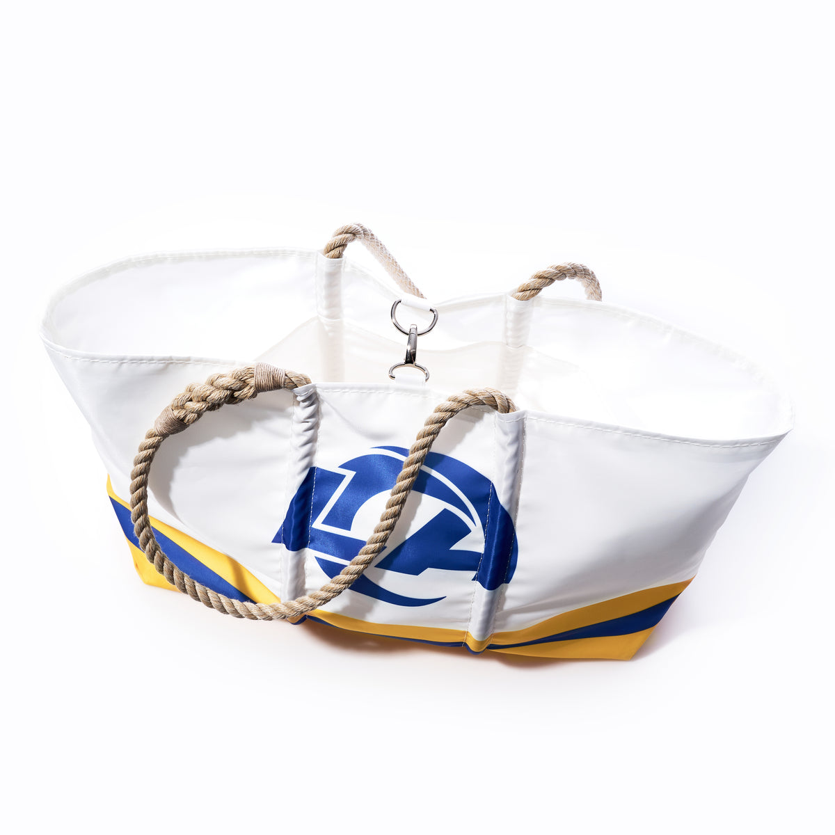 Los Angeles Rams Tailgate Tote by Sea Bags—a white tote bag with rope handles, crafted from recycled sail cloth and featuring a blue and yellow abstract design inspired by the Rams; includes multiple inner pockets and is photographed from above on a white background. by Sea Bags