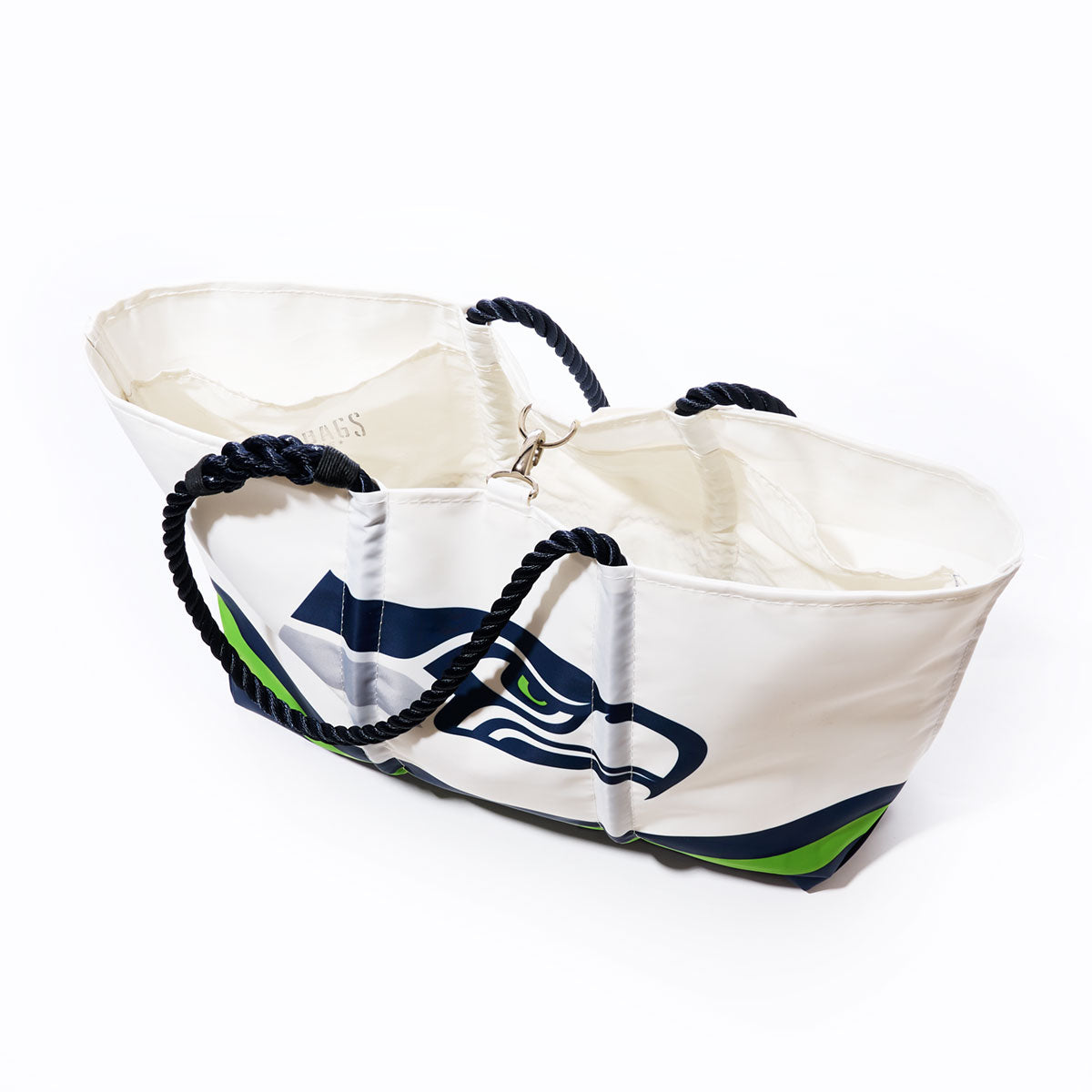 The Seattle Seahawks Tailgate Tote by Sea Bags is crafted from recycled sail cloth and features a bold Seahawks logo, blue and green accents, and two navy blue rope handles—shown against a white background, this is the ideal NFL tote for any Seahawks fan. by Sea Bags