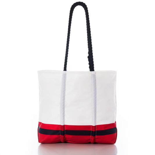 The Kansas City Chiefs Medium Tote by Sea Bags is crafted from recycled sail cloth for added durability, featuring black rope handles, a bold red bottom section, and a horizontal black stripe near the base—an eco-friendly choice perfect for Chiefs fans. Photographed on a white background. by Sea Bags