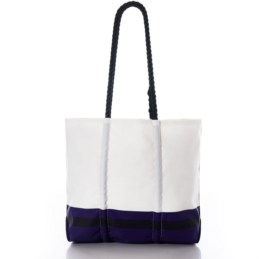 Show your Maryland pride with the Baltimore Ravens Medium Tote by Sea Bags—a white tote bag featuring black rope handles and a navy-blue and black striped bottom section, crafted from recycled sail cloth. Displayed on a white background. by Sea Bags