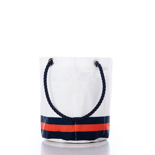 Sea Bags Chicago Bears Beverage Bucket—crafted from recycled sail cloth—is a white, bucket-style bag featuring dark blue rope handles and horizontal navy and orange stripes near the bottom, reminiscent of a Chicago Bears cooler, photographed on a white background. by Sea Bags