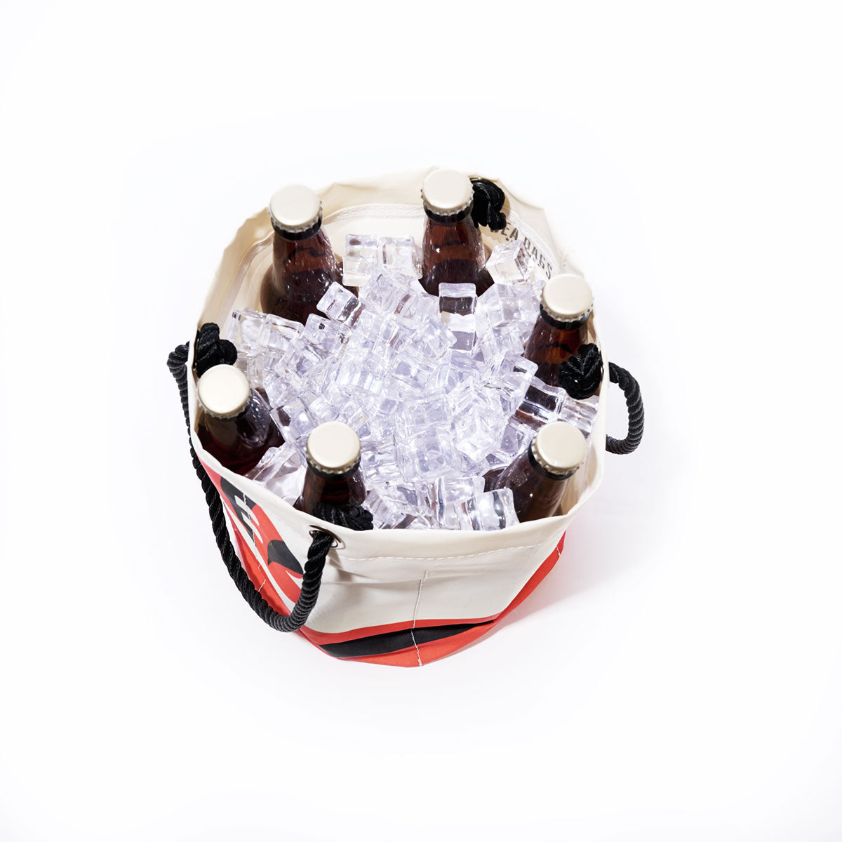 Six brown bottles in a round Sea Bags Cincinnati Bengals Beverage Bucket, filled with ice cubes and viewed from above, against a plain white background. by Sea Bags