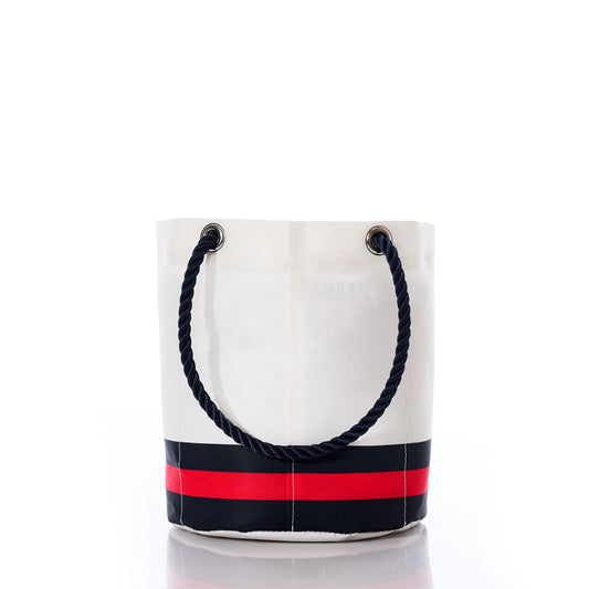 The Houston Texans Beverage Bucket by Sea Bags features black rope handles and a distinctive black and red stripe near the base. Photographed on a white background, this stylish bucket is perfect as a sustainable cooler for your favorite drinks or as an eye-catching accessory for any Texans fan. by Sea Bags
