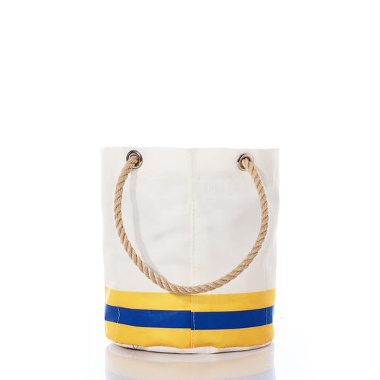The Los Angeles Rams Beverage Bucket by Sea Bags features white canvas with tan rope handles, yellow and blue horizontal stripes near the base, and metal grommets at the top—combining nautical elegance with team spirit, this stylish and sustainable cooler is perfect for carrying everyday essentials or enjoying weekend adventures. by Sea Bags