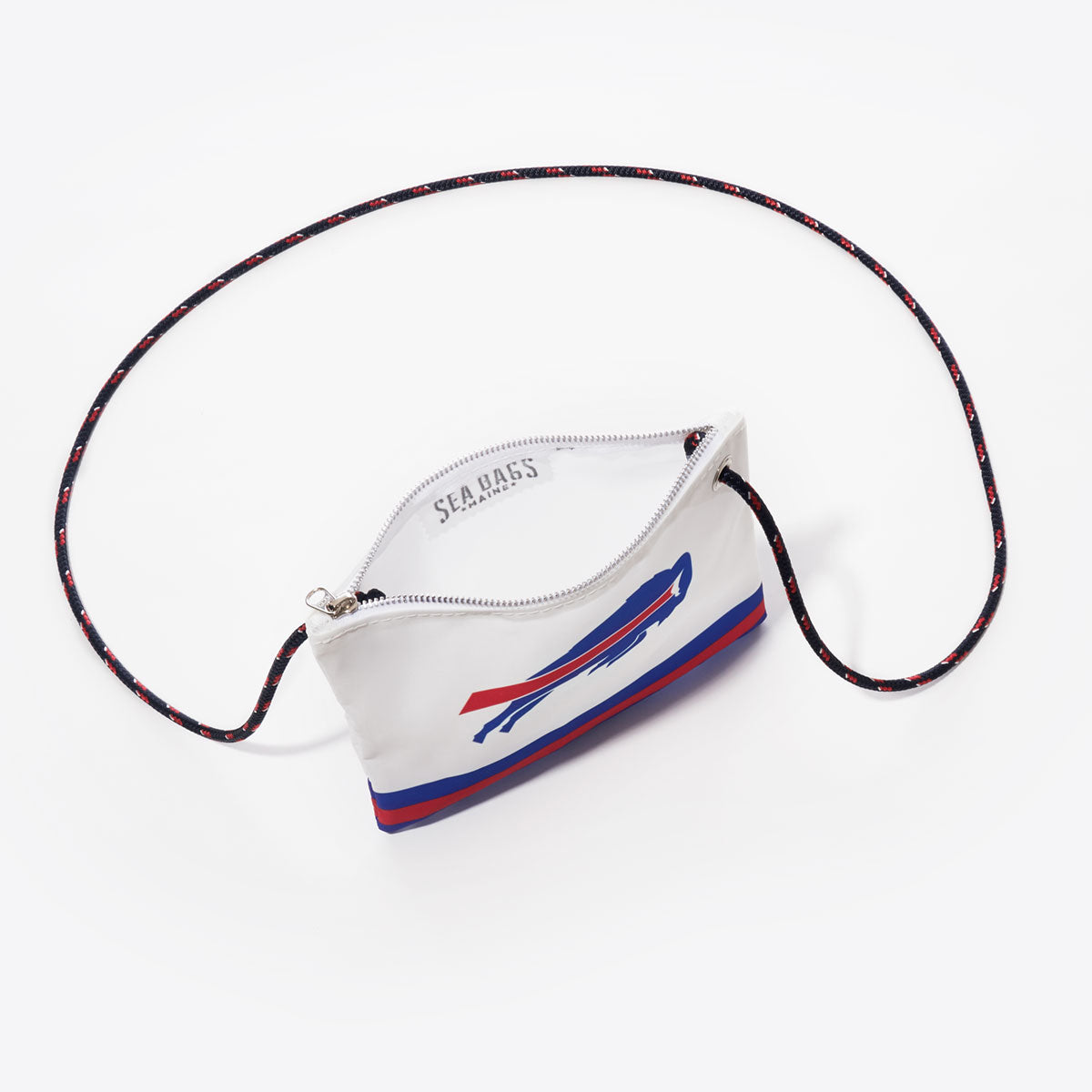 Introducing the Sea Bags Buffalo Bills Slim Crossbody—a small white zippered pouch crafted from recycled sail cloth, featuring a blue and red buffalo logo, a bold blue stripe, and a long black cord strap. With SEA BAGS text visible inside, this sustainable crossbody is the perfect accessory for Buffalo Bills fans who appreciate style and eco-friendly design. by Sea Bags