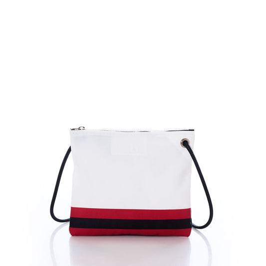 The Atlanta Falcons Slim Crossbody by Sea Bags is a white zippered crossbody bag crafted from recycled sail cloth, featuring a black strap and bold black and red stripes near the bottom, displayed against a white background. by Sea Bags