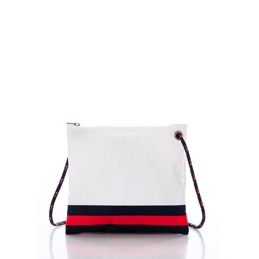 The Houston Texans Slim Crossbody by Sea Bags is a white zippered bag featuring navy and red horizontal stripes at the bottom and a navy, red, and white rope strap, crafted from recycled sail cloth and shown on a white background. by Sea Bags