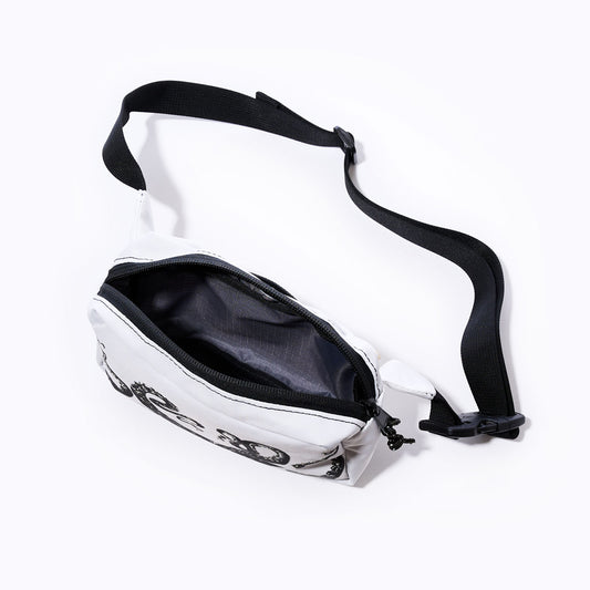 The Sea Bags Octopus Belt Bag is a compact white waist bag made from recycled sail cloth, featuring a zippered closure and a black adjustable strap. Shown open to reveal its empty interior against a plain white background, its the ideal belt bag for carrying your travel essentials. by Sea Bags