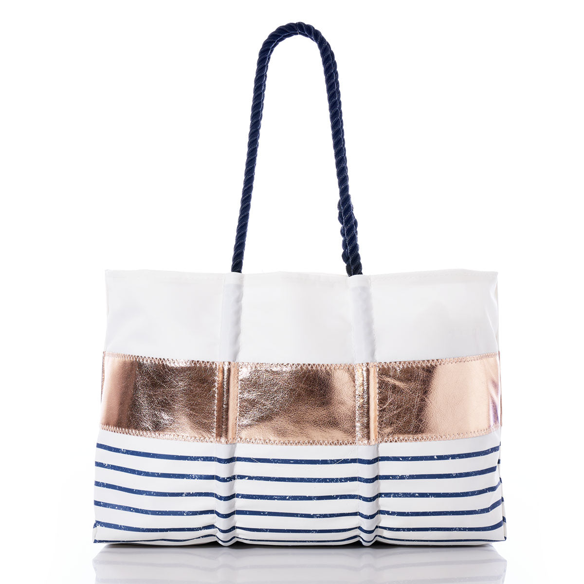 Sea Bags’ Custom Monogram Rose Gold-on-Navy Mariner Stripe Large Tote—a spacious white bag featuring navy rope handles, a striking rose gold metallic band, and bold blue stripes along the lower half—brings a touch of nautical chic to your everyday style. by Sea Bags