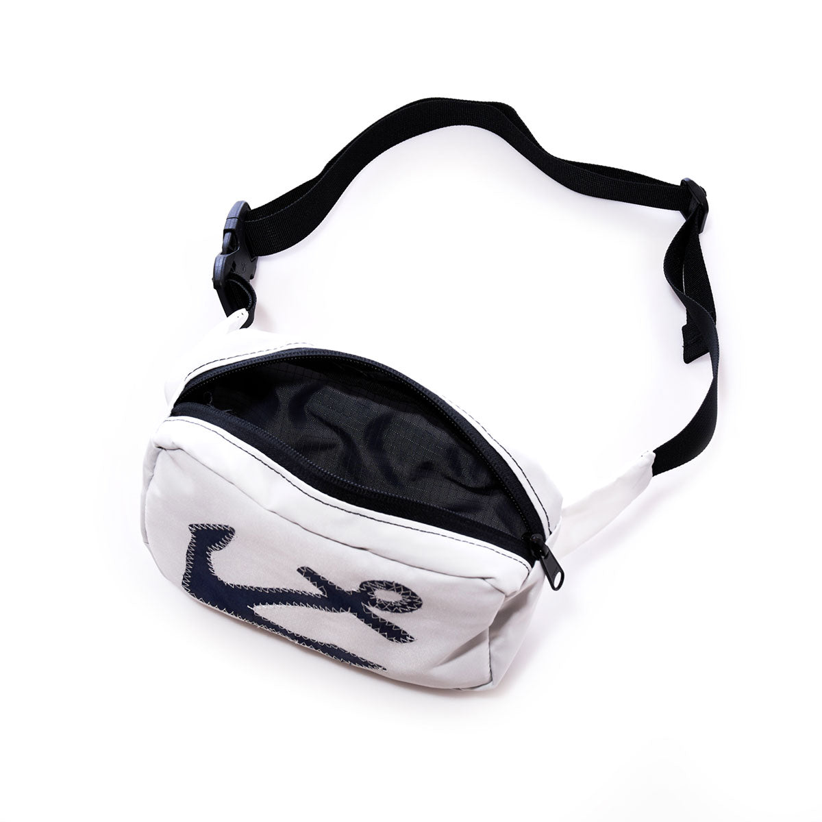 The Sea Bags Navy Anchor Belt Bag, shown on a white background, is crafted from recycled sail cloth and features a bold navy anchor graphic on the front. This white waist bag comes with a black adjustable strap and zipper, blending eco-friendly durability with stylish design. by Sea Bags