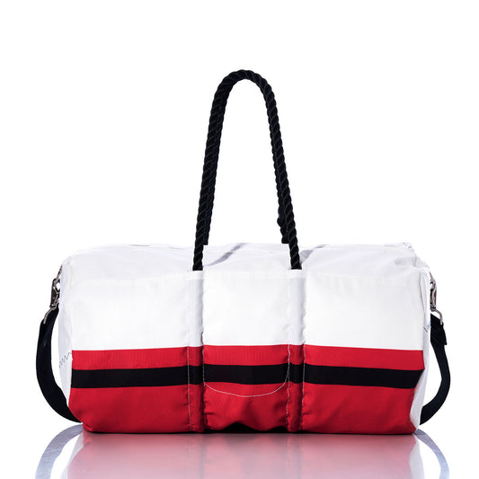 The Sea Bags Kansas City Chiefs Duffel, crafted from recycled sail cloth and officially licensed by the NFL, features a white and red design with a black stripe, black rope handles, and a black shoulder strap. Displayed on a reflective surface against a white background, this duffel is the perfect gym bag for any Chiefs fan. by Sea Bags