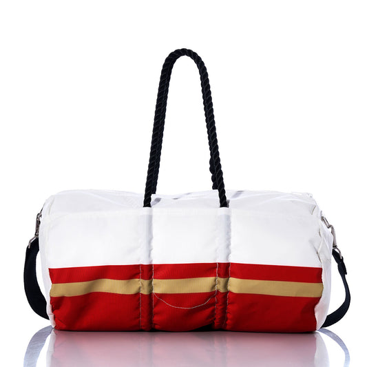 The Sea Bags San Francisco 49ers Duffel, crafted from recycled sail cloth, features a white and red design with a gold stripe and black rope handles. It is displayed on a reflective surface against a white background. by Sea Bags