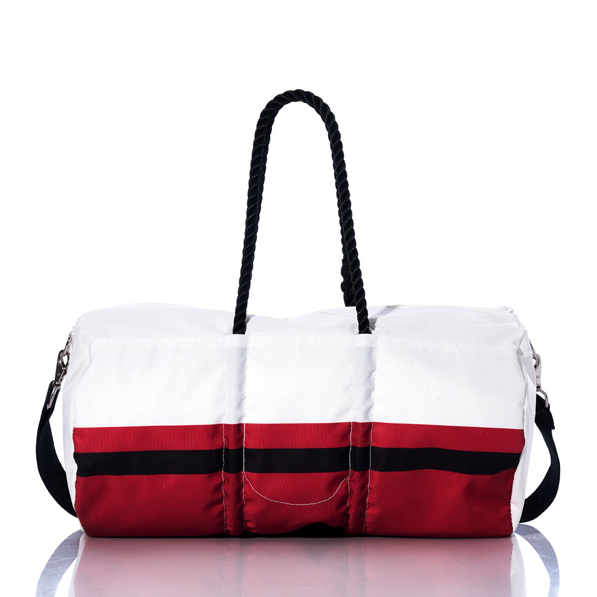 The Atlanta Falcons Duffel by Sea Bags is crafted from recycled sail cloth in white, featuring red and black horizontal stripes, two black rope handles, and a detachable black shoulder strap, displayed on a reflective surface. by Sea Bags