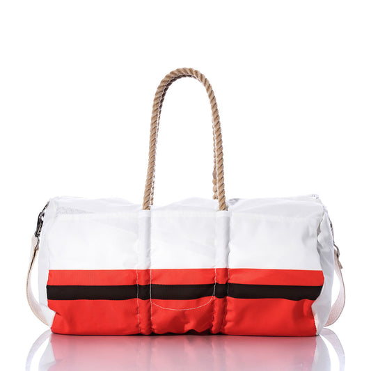 Introducing the Cleveland Browns Duffel by Sea Bags—a white duffel bag featuring bold red and black horizontal stripes, rope handles, and a white shoulder strap. Displayed on a reflective surface, this stylish bag is crafted from recycled sail cloth for exceptional durability and eco-friendly appeal. by Sea Bags