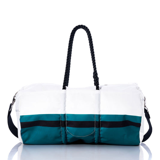 The Sea Bags Jacksonville Jaguars Duffel, crafted from recycled sail cloth in white and teal with black stripes, black rope handles, and a detachable shoulder strap, is showcased on a reflective surface against a white background. by Sea Bags