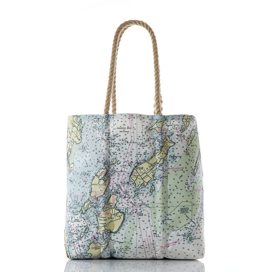 Sea Bags Casco Bay Nautical Chart Medium Tote, photographed on a white background, features rope handles and is crafted from recycled sail cloth. This tote showcases a printed nautical map design highlighting parts of Japan and nearby areas, reflecting the maritime heritage of Portland, Maine. by Sea Bags