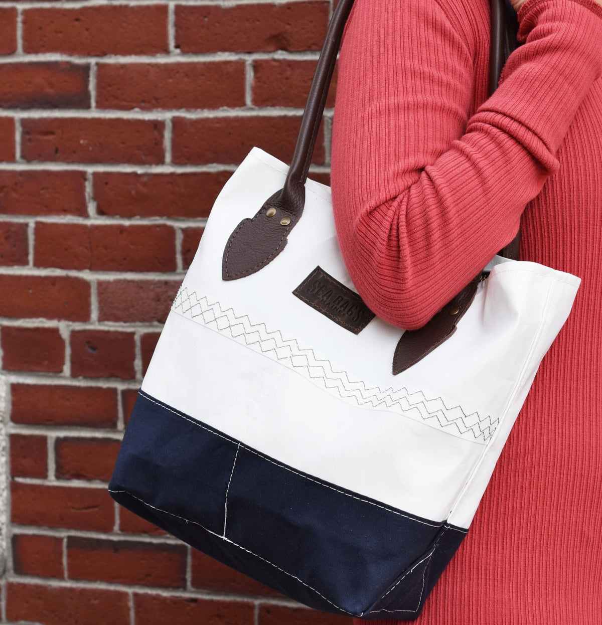 Chebeague handbag made of recycled sails, on woman's shoulder
