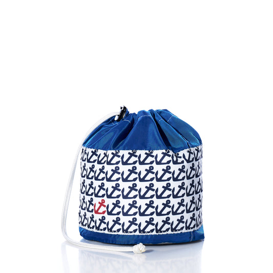 Sea Bags Anchor Pop Ditty Bag, crafted from durable sail cloth, features a blue and white design with a repeated navy anchor pattern and a single standout red anchor, shown against a plain white background.