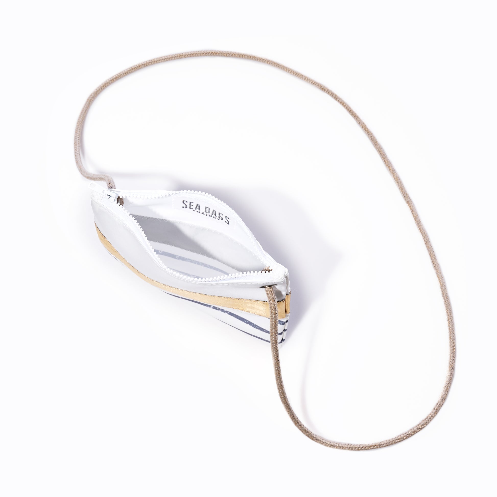 Grey Mariner Stripe Slim Crossbody Bag by Sea Bags, featuring a slim silhouette with grey mariner stripes, tan strap, and crafted from recycled sail cloth; photographed from above on a white background. by Sea Bags