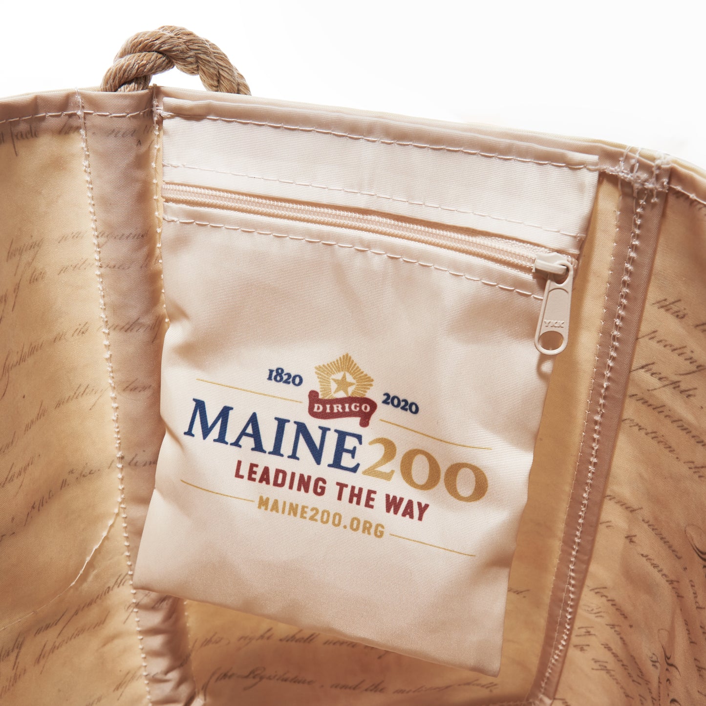 Crafted from recycled sail cloth, the Sea Bags Maine Bicentennial Medium Tote features an interior pocket with the Maine 200 Leading the Way logo and website, commemorating Maine’s bicentennial 1820–2020—a perfect gift that honors Maine’s heritage and commitment to sustainability. by Sea Bags