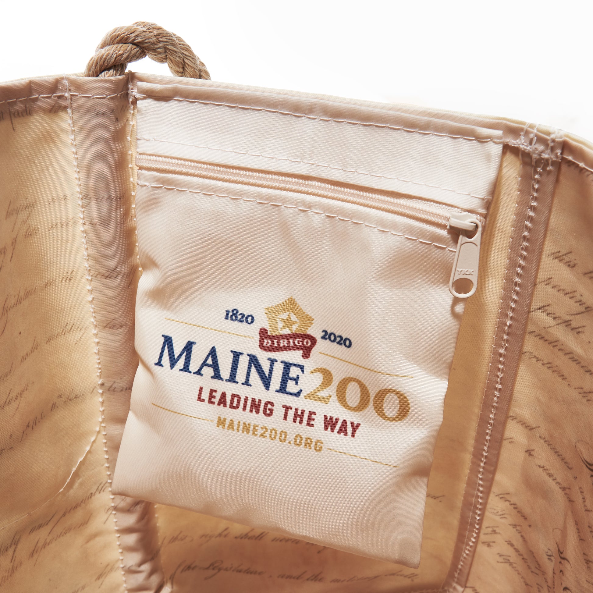Crafted from recycled sail cloth, the Sea Bags Maine Bicentennial Medium Tote features an interior pocket with the Maine 200 Leading the Way logo and website, commemorating Maine’s bicentennial 1820–2020—a perfect gift that honors Maine’s heritage and commitment to sustainability. by Sea Bags
