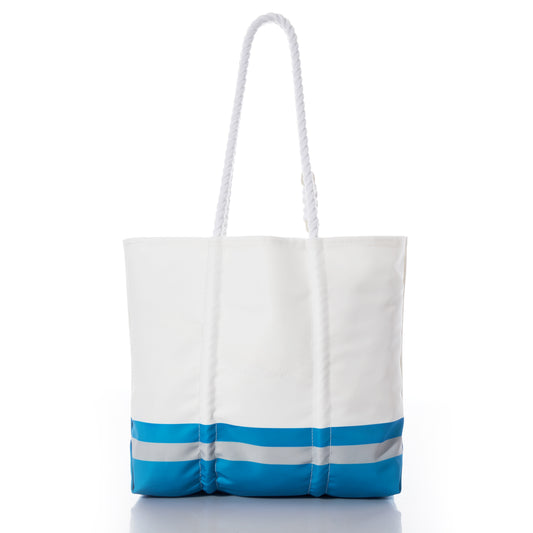 The Sea Bags Detroit Lions Medium Tote is a white tote bag crafted from recycled sail cloth, featuring two horizontal blue stripes near the bottom and long white rope handles. Photographed on a white background, this durable bag is ideal for everyday use and subtly reflects Detroit Lions style. by Sea Bags